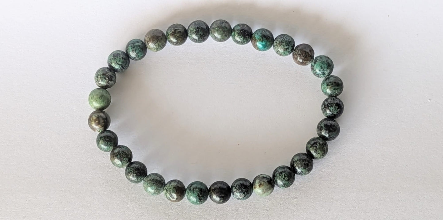 BRACELET EN TURQUOISE AFRICAINE – Perles 6 mm – Artisanat de Madagascar Pierre d’évolution & équilibre intérieur | Vert‑bleu moucheté | Bracelet élastique fait main