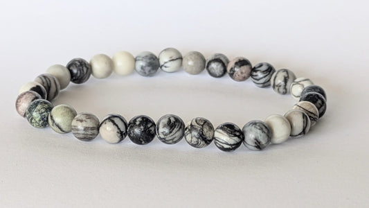 BRACELET EN OBSIDIENNE NEIGE – Perles 6 mm – Artisanat de Madagascar Pierre d’équilibre & protection douce | Noir moucheté naturel | Bracelet élastique fait main
