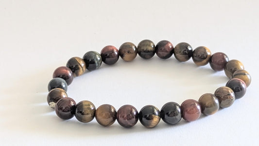 BRACELET EN ŒIL MIXTE (TIGRE • FAUCON • TAUREAU) – Perles 6 mm – Artisanat de Madagascar Pierre d’harmonie, protection & énergie équilibrée | Reflets dorés, bleutés et rouges | Bracelet élastique fait main