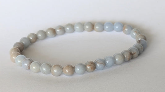 BRACELET EN QUARTZ LAVANDE – Perles 6 mm – Artisanat de Madagascar Pierre de douceur & apaisement émotionnel | Rose‑violet translucide | Bracelet élastique fait main