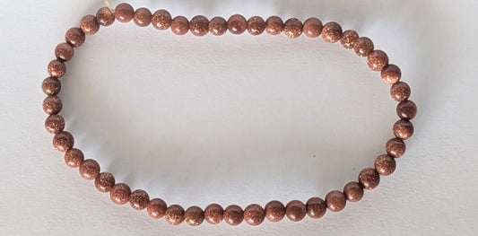 BRACELET SABLE DORE – Perles 4 mm – Artisanat de Madagascar Pierre d’énergie & ambition | Reflets dorés scintillants | Bracelet élastique fait main